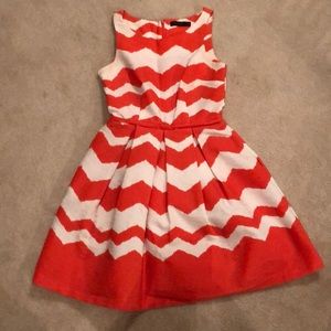 The limited orange and white chevron dress